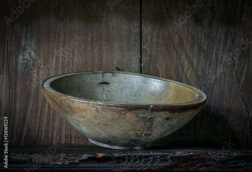 The ancient wooden plates on a shelf