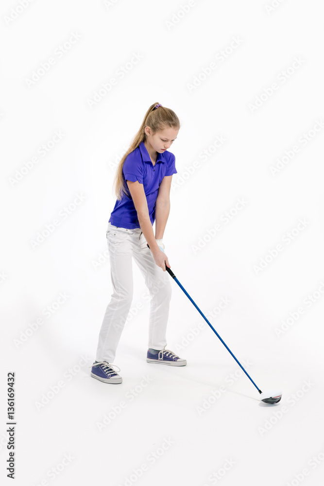Pretty girl golfer swinging with diver on white backgroud in studio Pretty girl golfer swinging with diver on white backgroud in studio