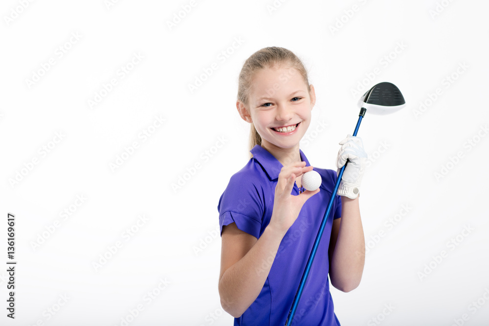 Pretty girl golfer posing with golf club and ball on white backgroud in studio Pretty girl golfer posing with golf club and ball on white backgroud in studio
