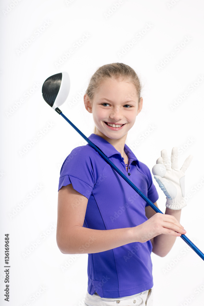 Pretty girl golfer posing with golf club and ball on white backgroud in studio Pretty girl golfer posing with golf club and ball on white backgroud in studio