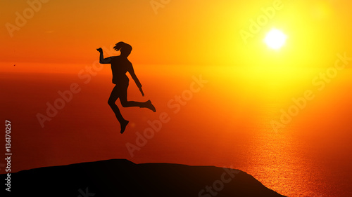 Fototapeta Naklejka Na Ścianę i Meble -  Two beautiful silhouette of a girl jumping at sunset