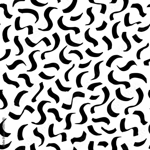The seamless black and white pattern with brush strokes.