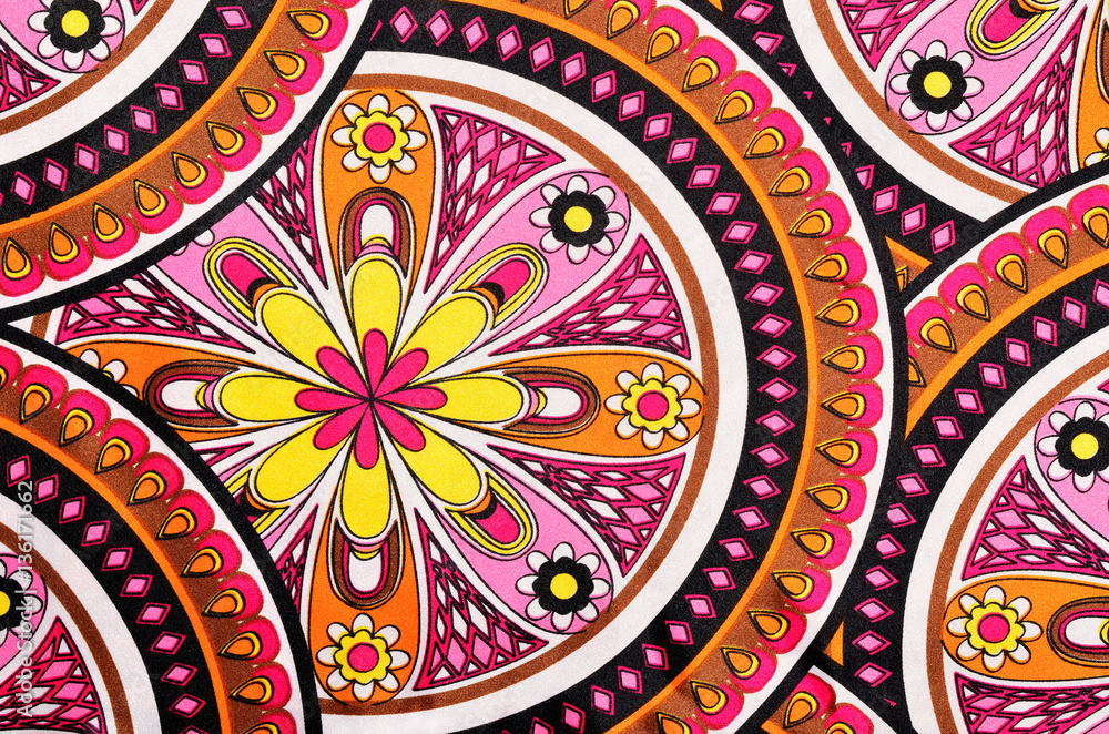 Floral and circles pattern with pink and yellow on satin fabric.