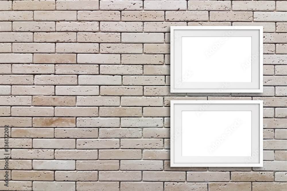 Two white frames mock ups on decorative bricks wall Two white frames mock ups on decorative bricks wall