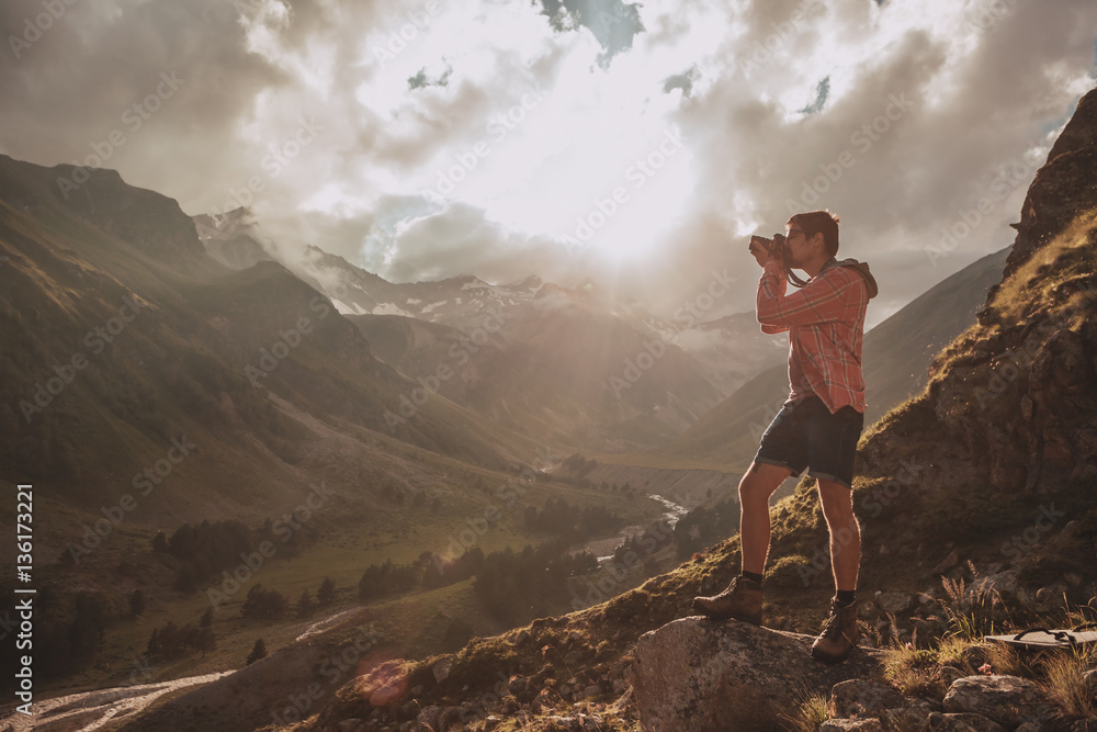 Fototapeta premium Man Traveler hiking Travel Lifestyle concept beautiful mountains landscape on background Summer journey adventure vacations outdoor