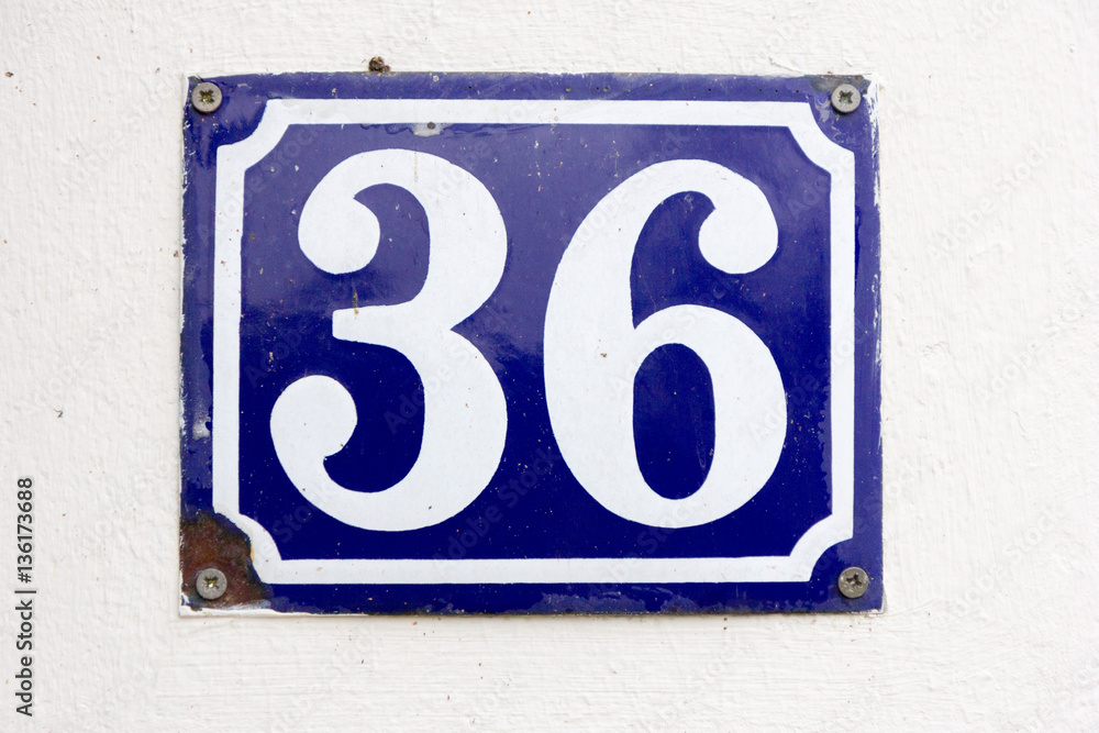 Number 36 (thirty six) in white on a blue metal plate Number 36 (thirty six) in white on a blue metal plate