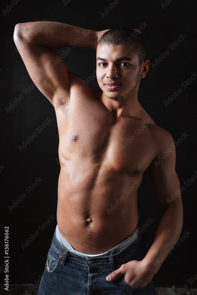 Attractive shirtless african american fitness man standing and posing