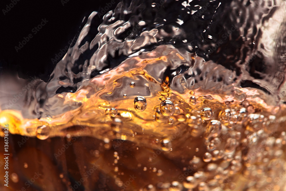 Abstract splashes of white wine on a black background Abstract splashes of white wine on a black background