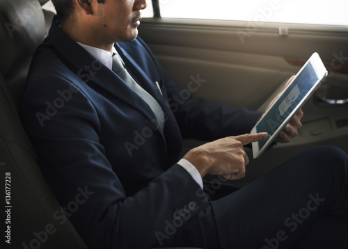 Businessman Use Tablet Inside Car