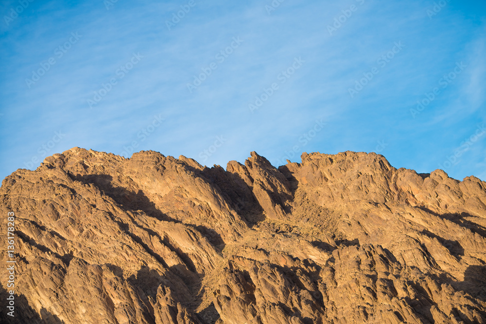 The beautiful mountain on the background of a blue sky The beautiful mountain on the background of a blue sky