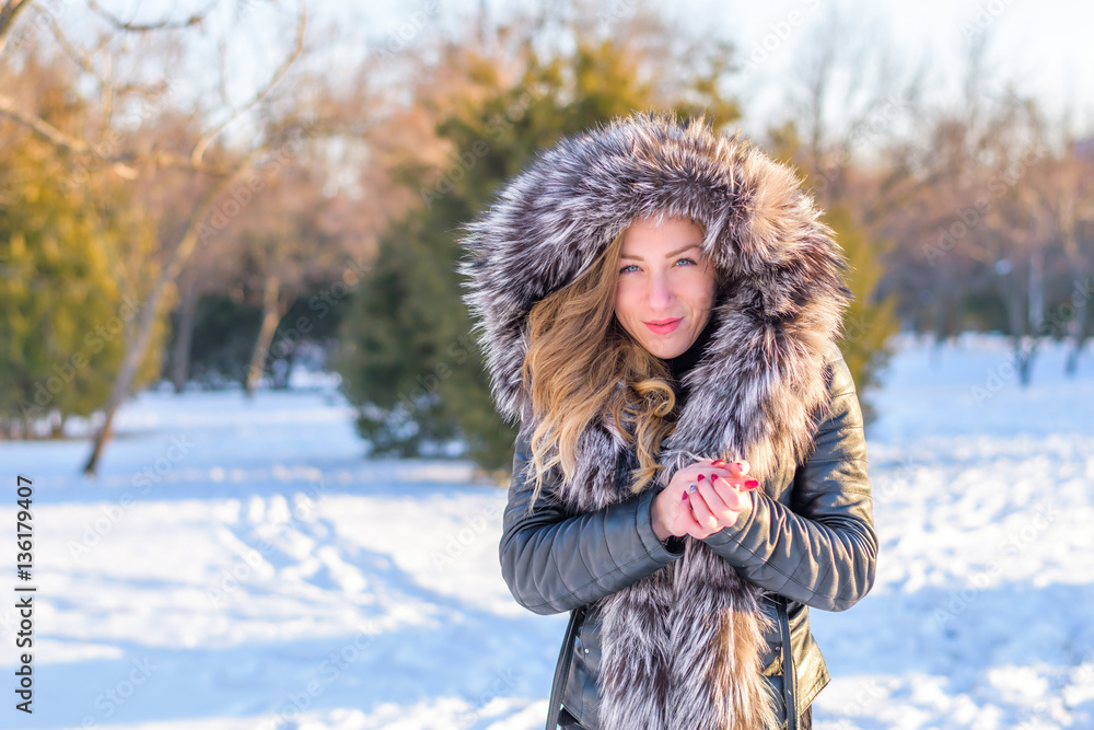 Girl in the park playing in the snow Girl in the park playing in the snow