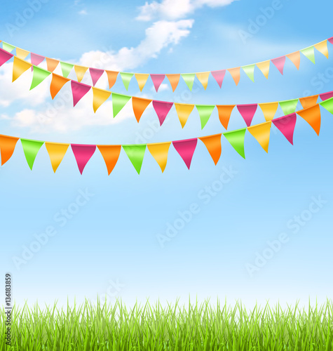 Grass lawn with bright buntings clouds on blue sky