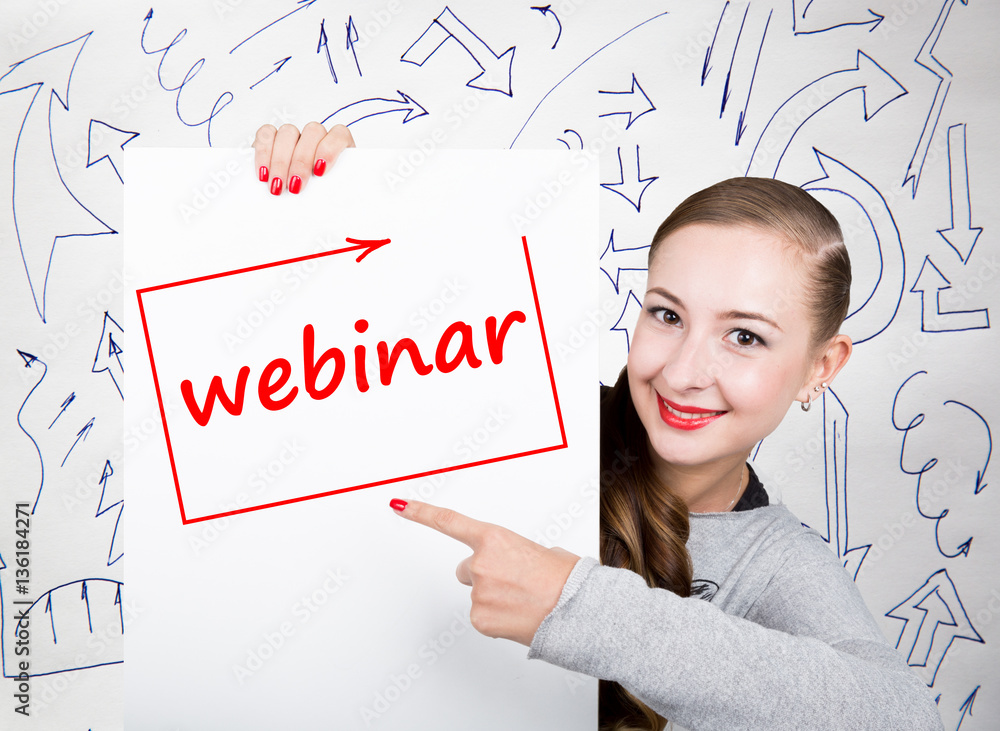 Young woman holding whiteboard with writing word: webinar. Technology, internet, business and marketing. Young woman holding whiteboard with writing word: webinar. Technology, internet, business and marketing.