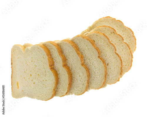 Top view of English muffin toasting bread slices spread out isolated on a white background.