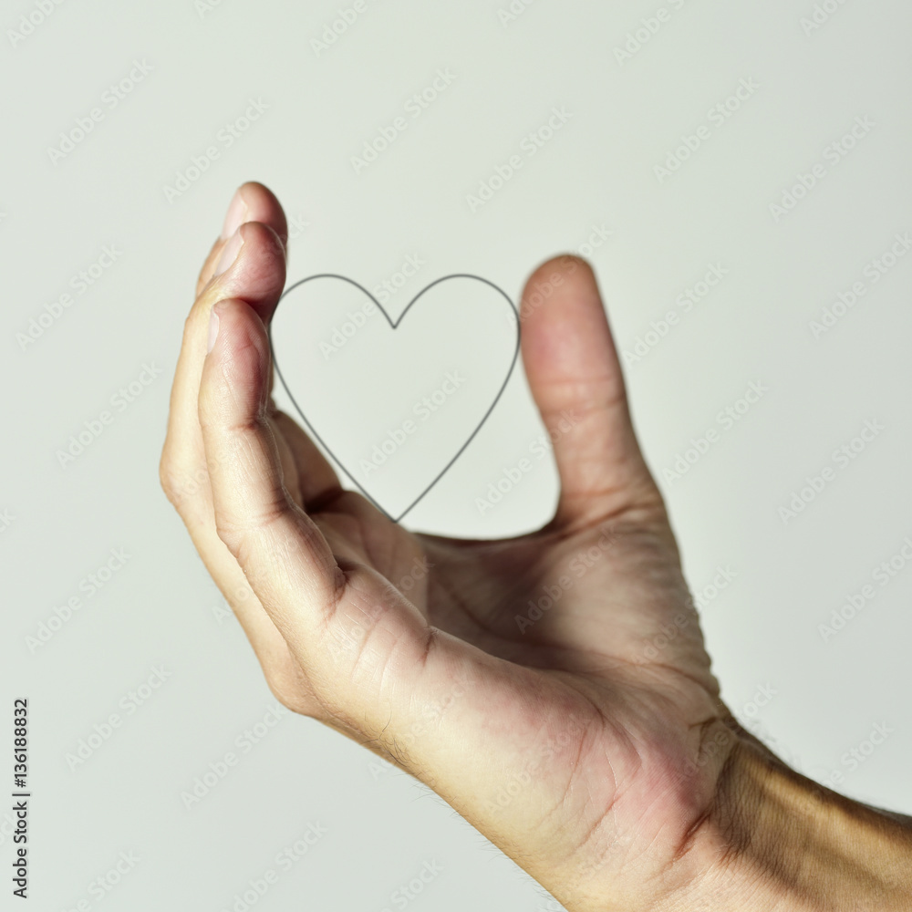Obraz premium heart in the hand of a man