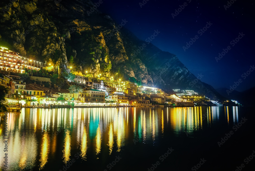 Fototapeta premium Scenic night view of illuminated town Limone sul Garda, Italy