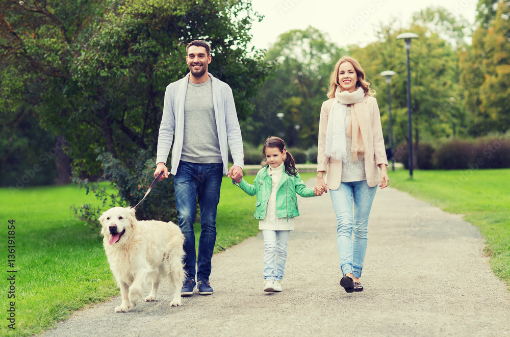 happy family with labrador retriever dog in park happy family with labrador retriever dog in park