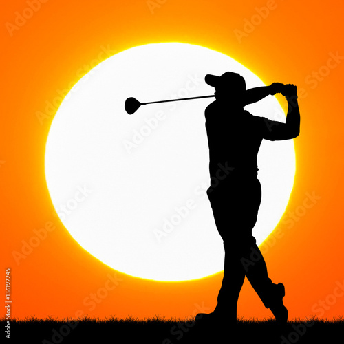 silhouettes golfers with sunset background