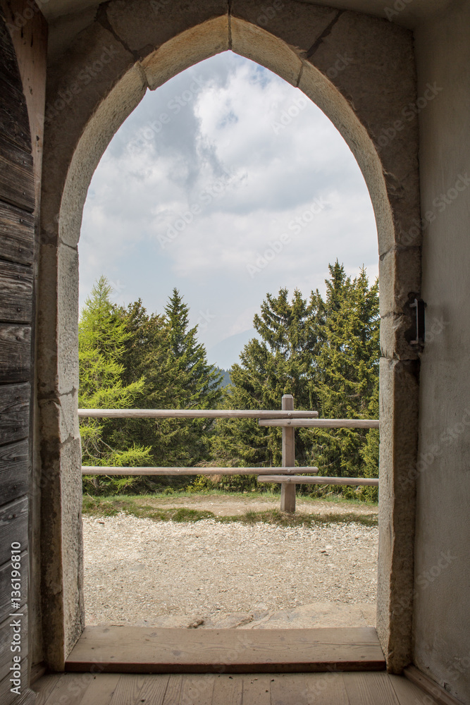View through door of St. Vigilius church on Vigiljoch, South Tyrol