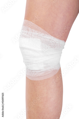 Wounded leg with bandage isolated on white background