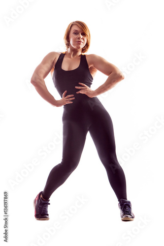 Beautiful fit woman making exercises.