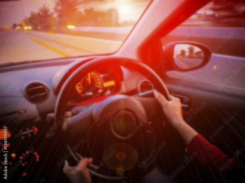 Blurred of  Hand Of Woman Driving A Car