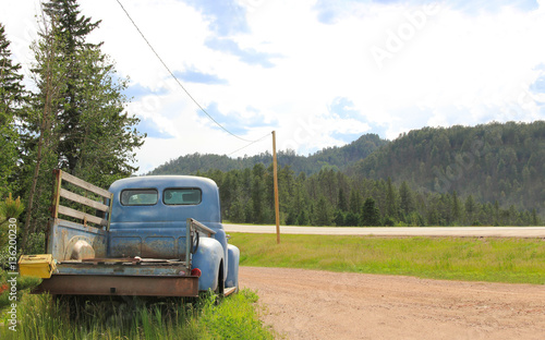 Old rusty pickup by the road
