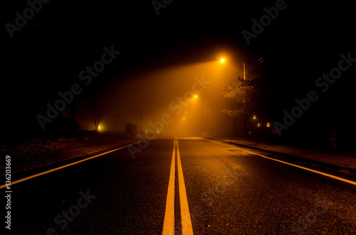 A Fog Covered Road at Night 
