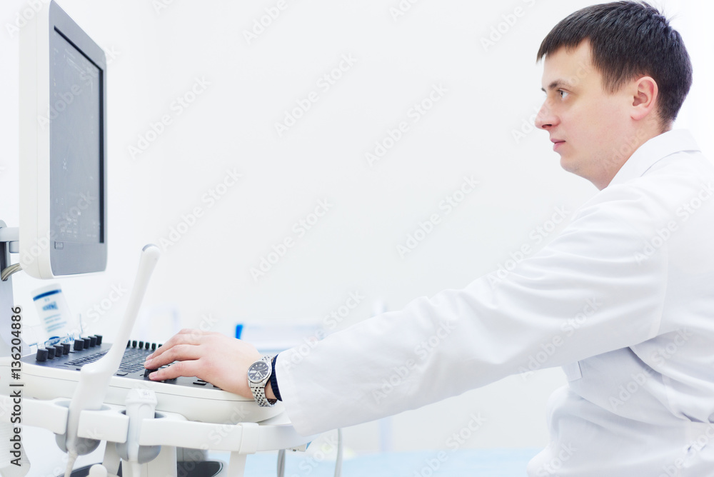 Ultrasound machine, doctor's hand usg investigation USCG Ultrasound machine, doctor's hand usg investigation USCG