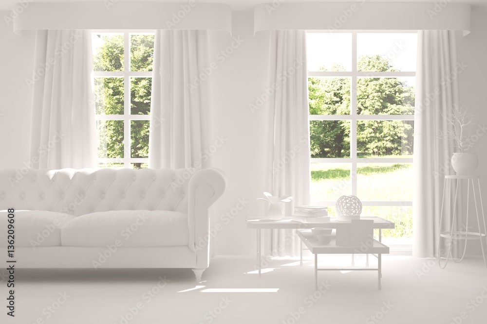 Modern interior design with sofa and green landscape in window Modern interior design with sofa and green landscape in window