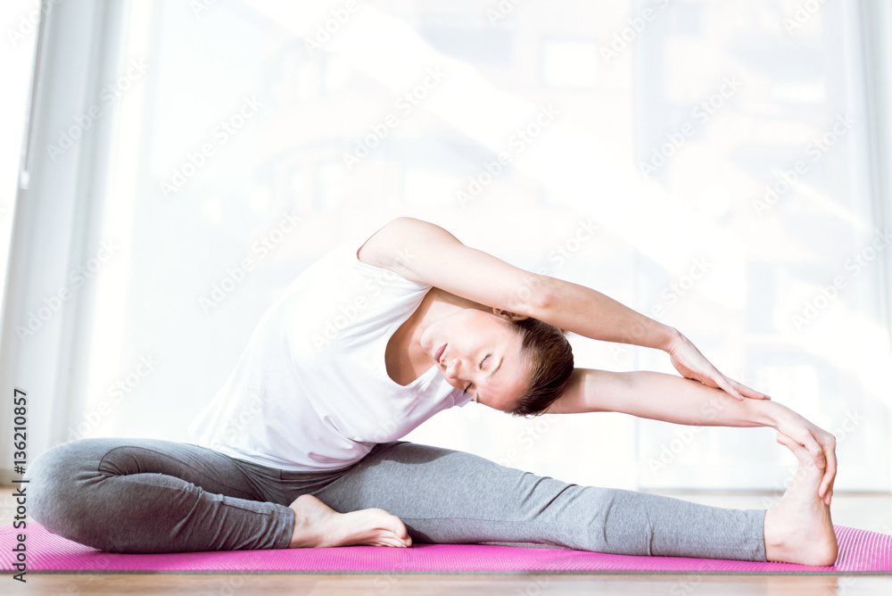 Beautiful healthy young woman doing exercise at home. Beautiful healthy young woman doing exercise at home.
