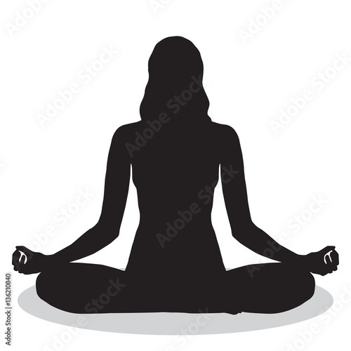 Woman peacefully meditating silhouette