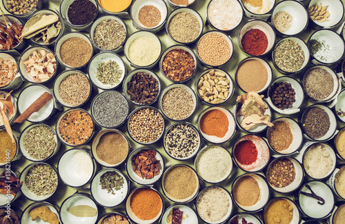 background texture of all sorts of spices in small bowls