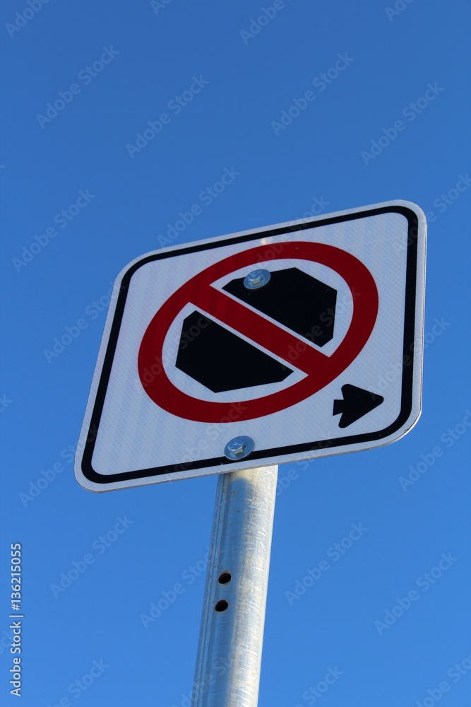No Stopping Right of Sign Against Blue Sky No Stopping Right of Sign Against Blue Sky