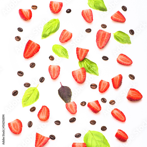 coffee beans, strawberry and sheets of basil on white background