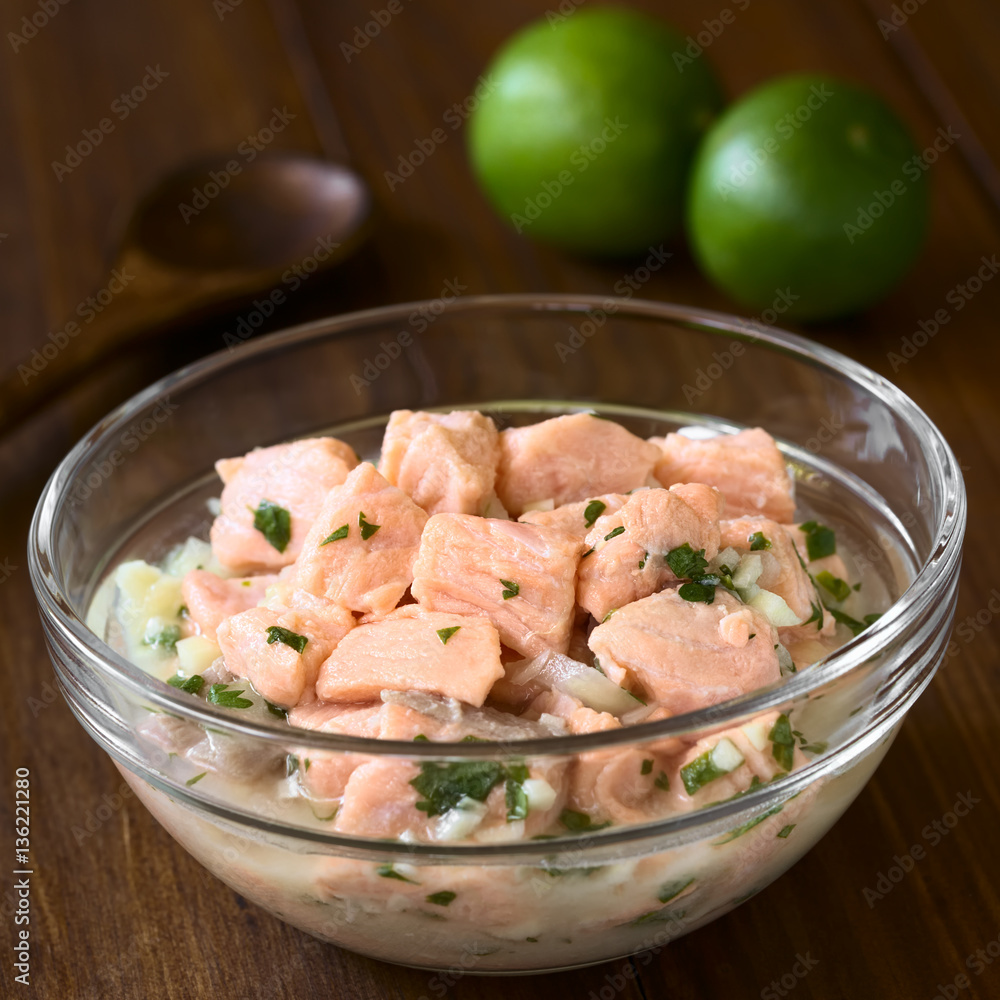 Chilean salmon ceviche prepared with onion, garlic, fresh coriander, salt and lemon juice, photographed with natural light (Selective Focus, Focus in the middle of the ceviche) Chilean salmon ceviche prepared with onion, garlic, fresh coriander, salt and lemon juice, photographed with natural light (Selective Focus, Focus in the middle of the ceviche)