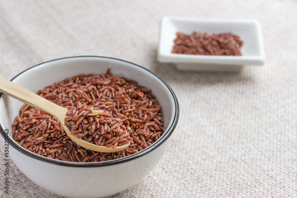 Raw red wild rice in ceramic bowl. Cereal for rice cereal Raw red wild rice in ceramic bowl. Cereal for rice cereal