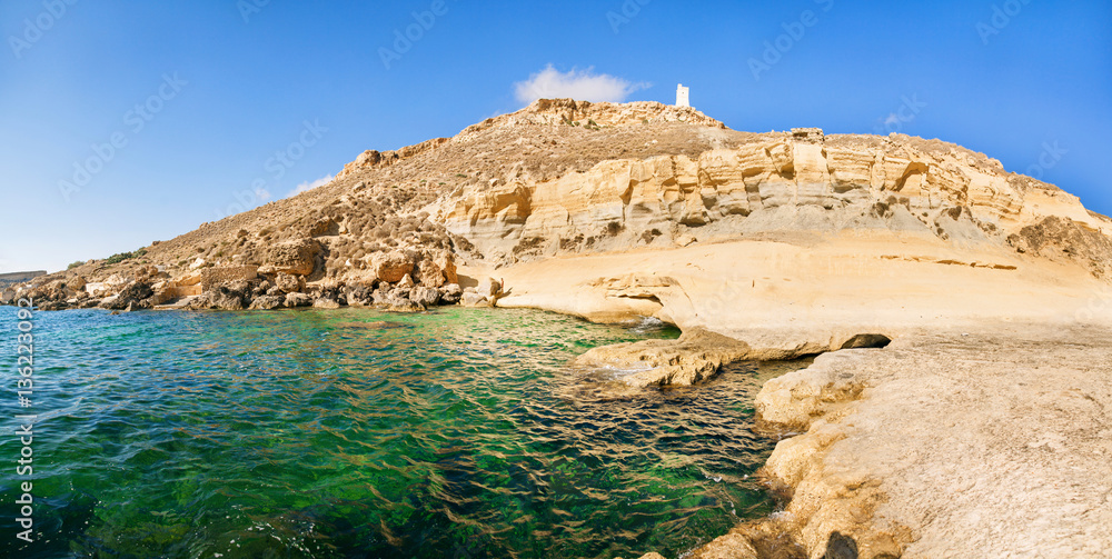 Blue lagoon with rocks on Malta