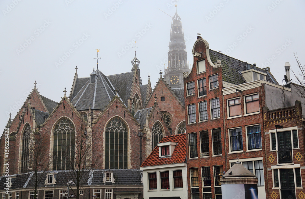 Old Church and historical houses in Amsterdam