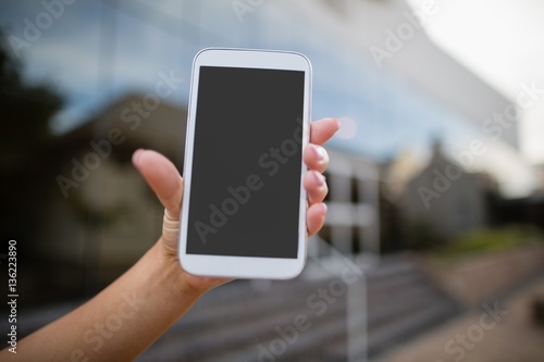 Woman holding a mobile phone