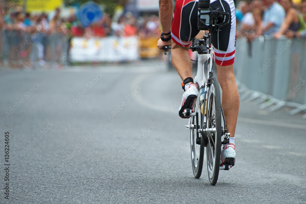 Fototapeta premium Unrecognizable professional cyclist during the bicycle competition. Back view.