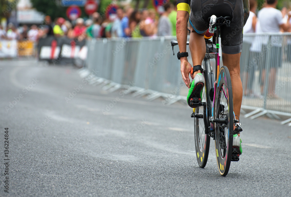 Fototapeta premium Unrecognizable professional cyclist during the bicycle competition. Back view.