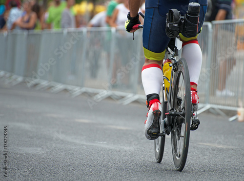 Unrecognizable professional cyclist during the bicycle competition. Back view. © M-Production