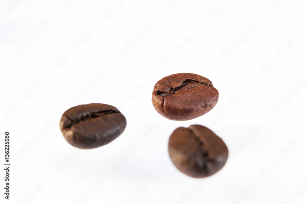 Photo macro coffee beans on a white background. Photo macro coffee beans on a white background.