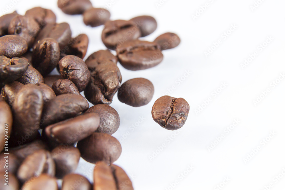 Photo macro coffee beans on a white background. Photo macro coffee beans on a white background.