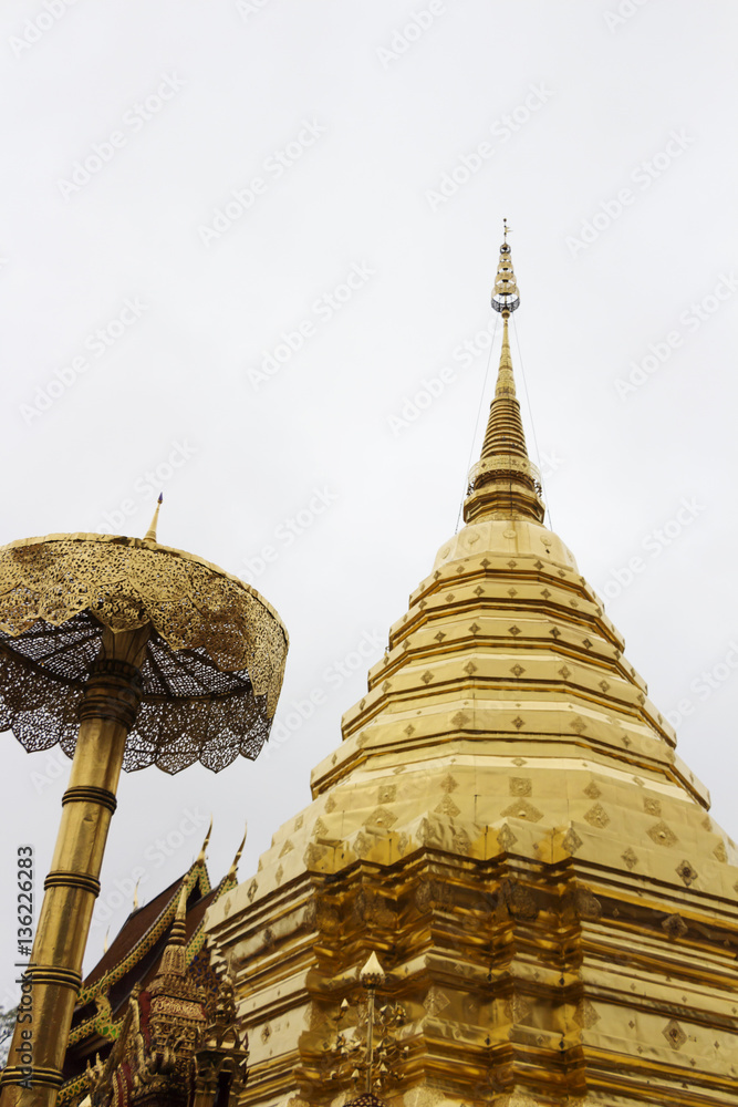 Fototapeta premium Golden pagoda in the temple on background sky.