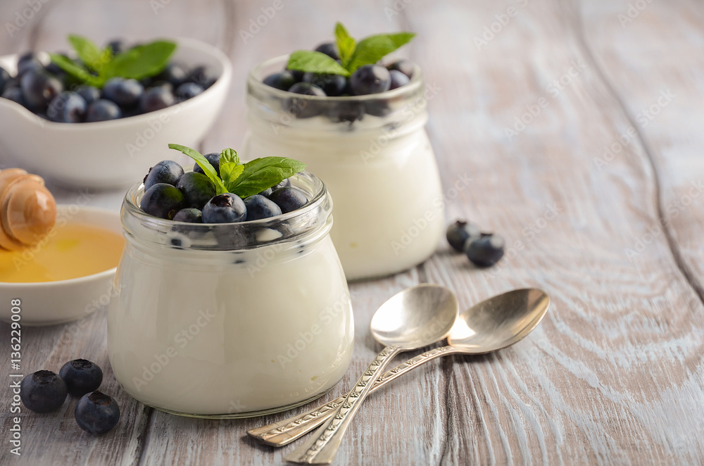 Natural homemade yogurt with blueberry and mint, selective focus, copy space Natural homemade yogurt with blueberry and mint, selective focus, copy space
