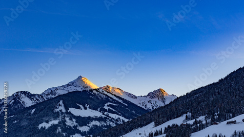 Photography alpenglow in snowy mountain landscape