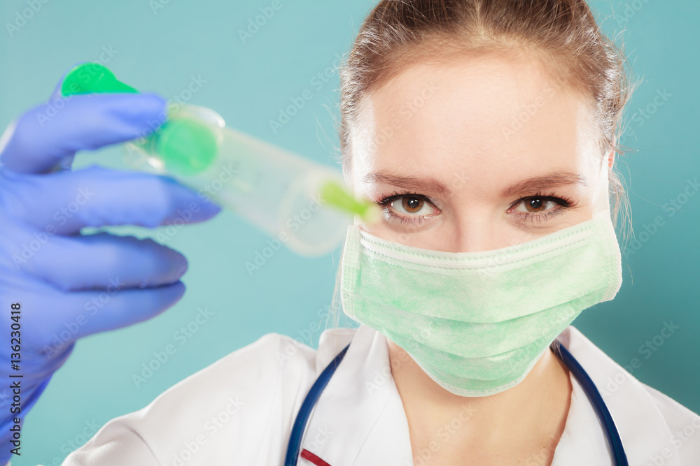 Professionalist in mask with syrigne Professionalist in mask with syrigne