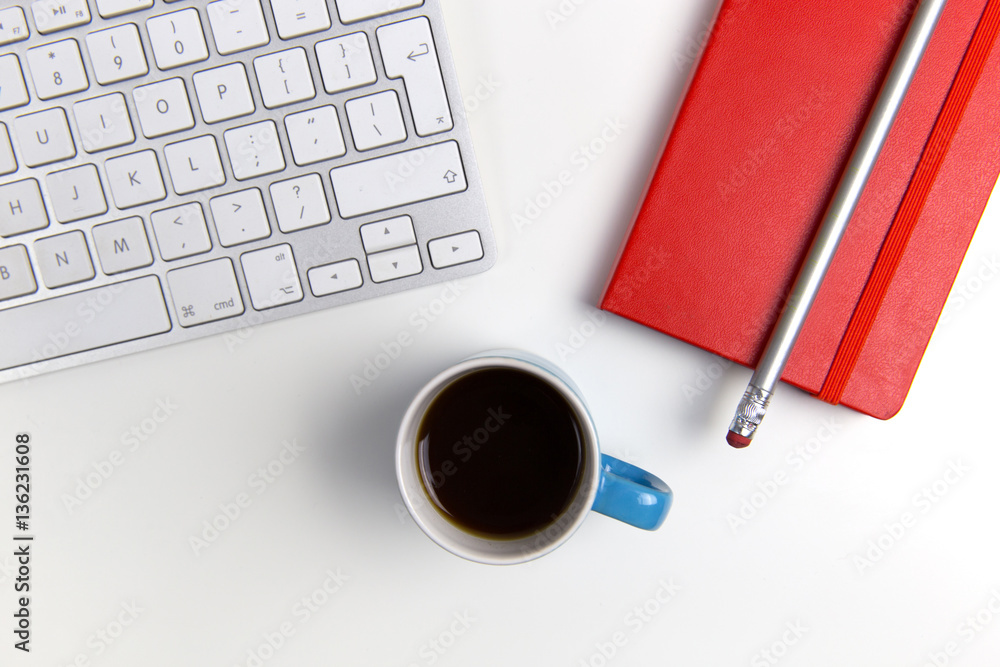 Computer keyboard, coffee and notebook on desk Computer keyboard, coffee and notebook on desk